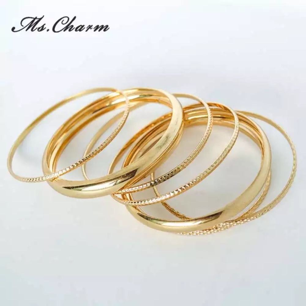 Multi layer charmed bracelet.